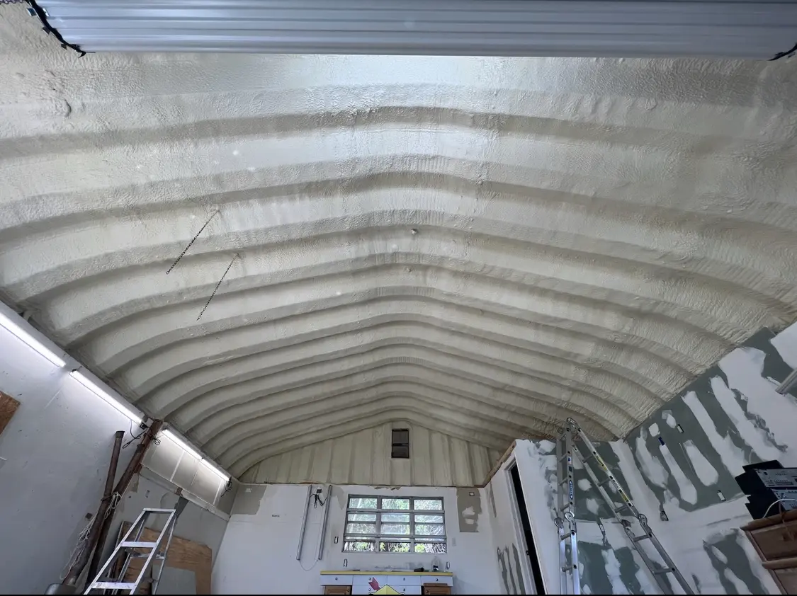 Spray polyurethane foam applied to the underside of a metal roof deck in Fleming Island